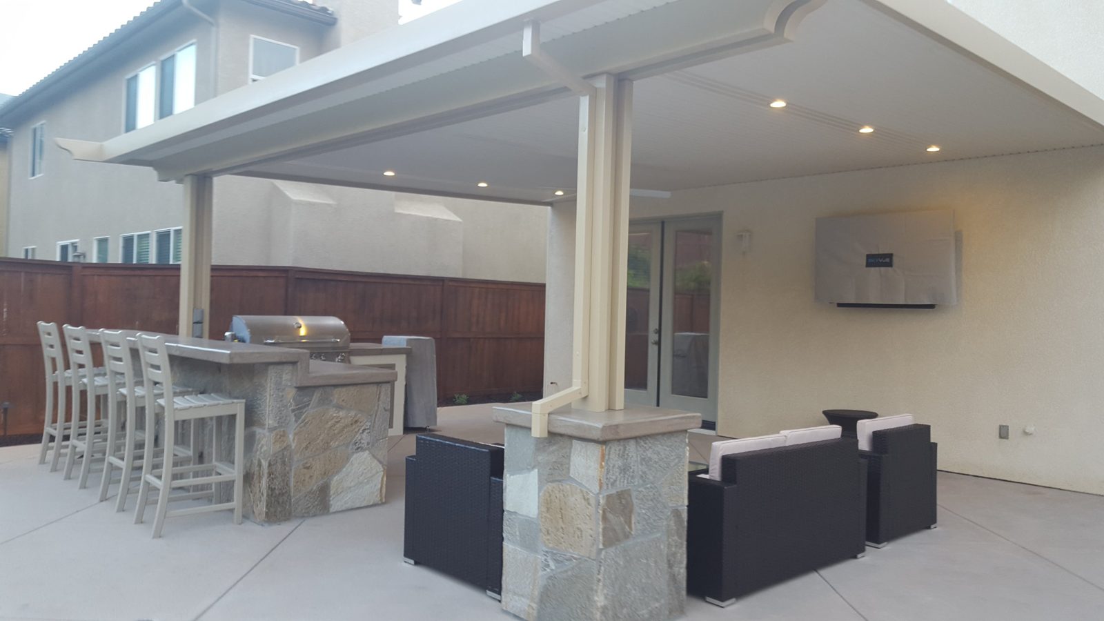 Recessed lights in a patio cover over an outdoor kitchen and lounge, 4S Ranch, San Diego