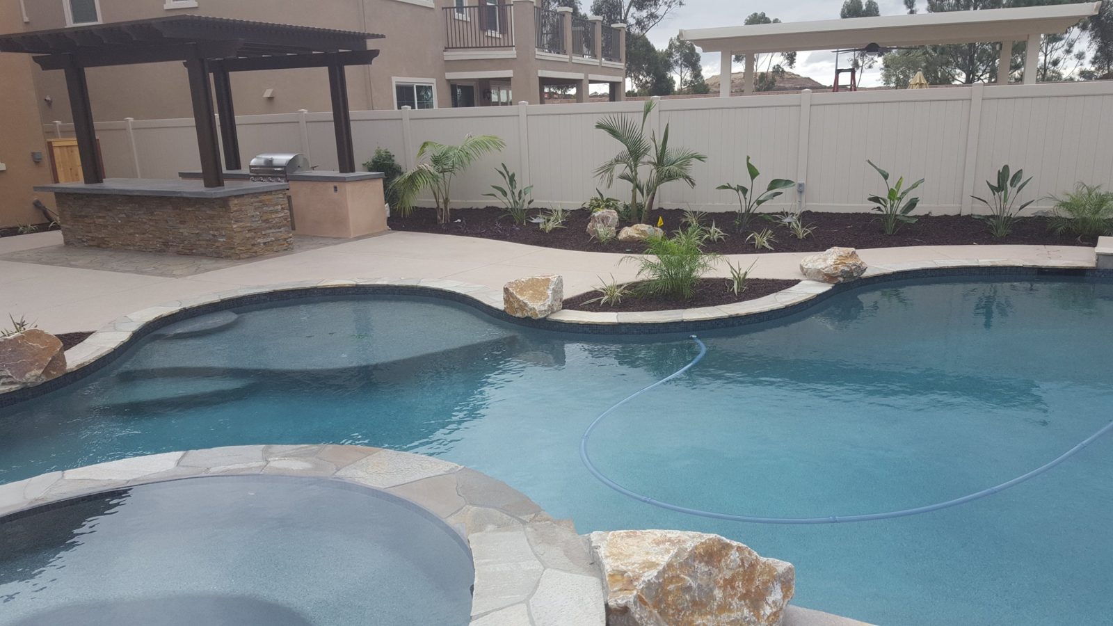 Pool with flagstone coping and boulders