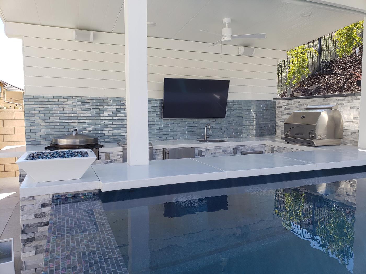 Swim-up bar and covered poolside kitchen