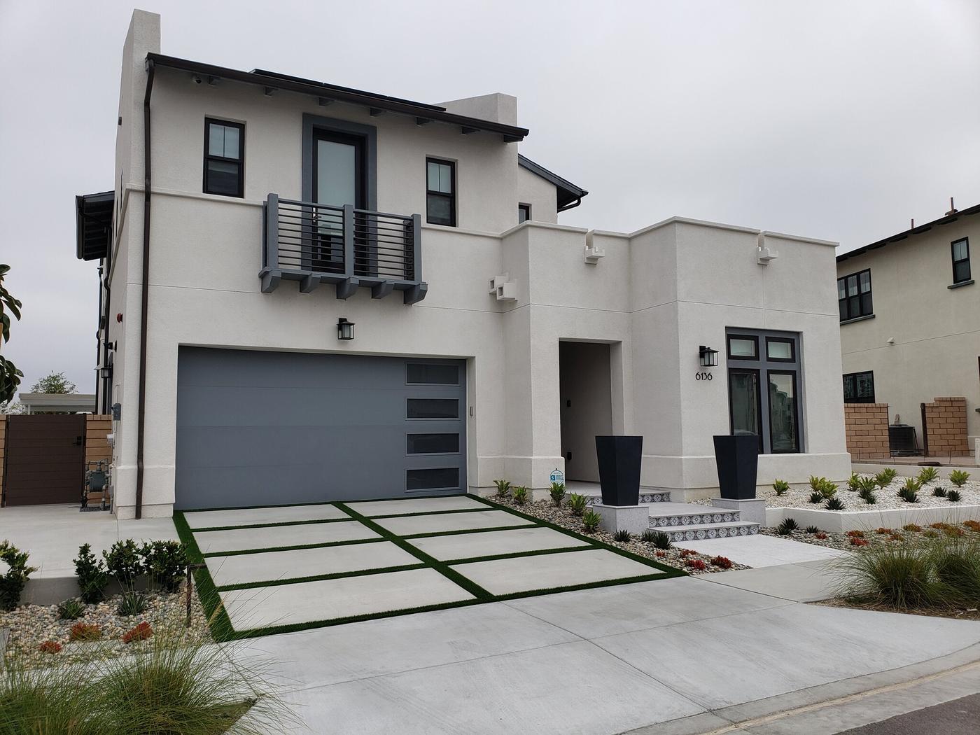 Front elevation with paver drive bands and drought planting